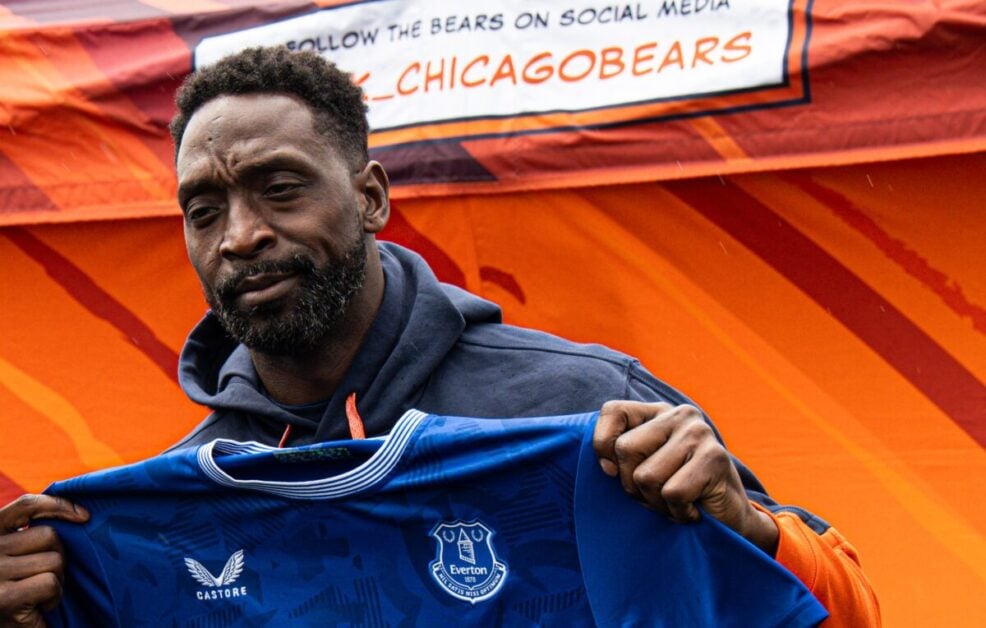 Charles Tillman poses with an Eveton jersey