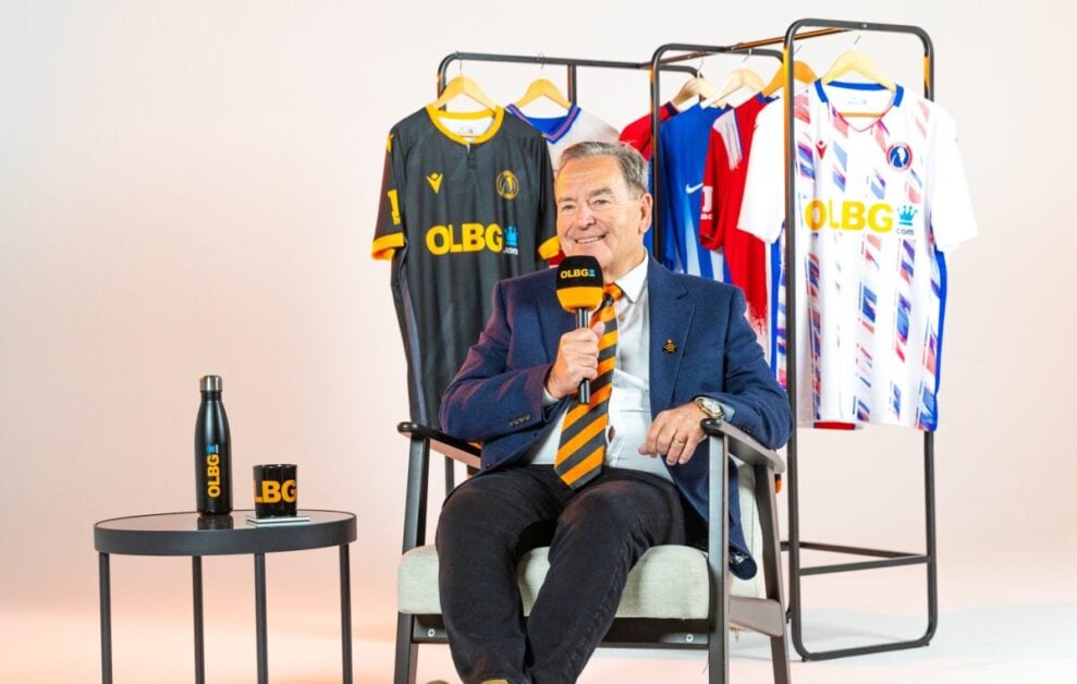 Jeff Stelling holding an OLBG microphone