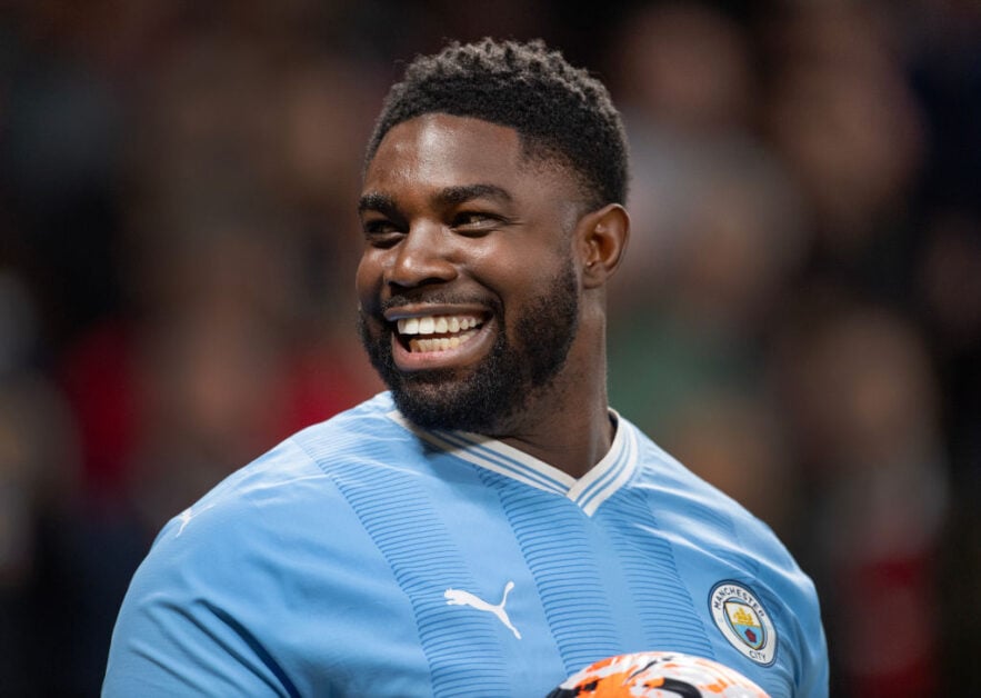Micah Richards wearing a Manchester City kit