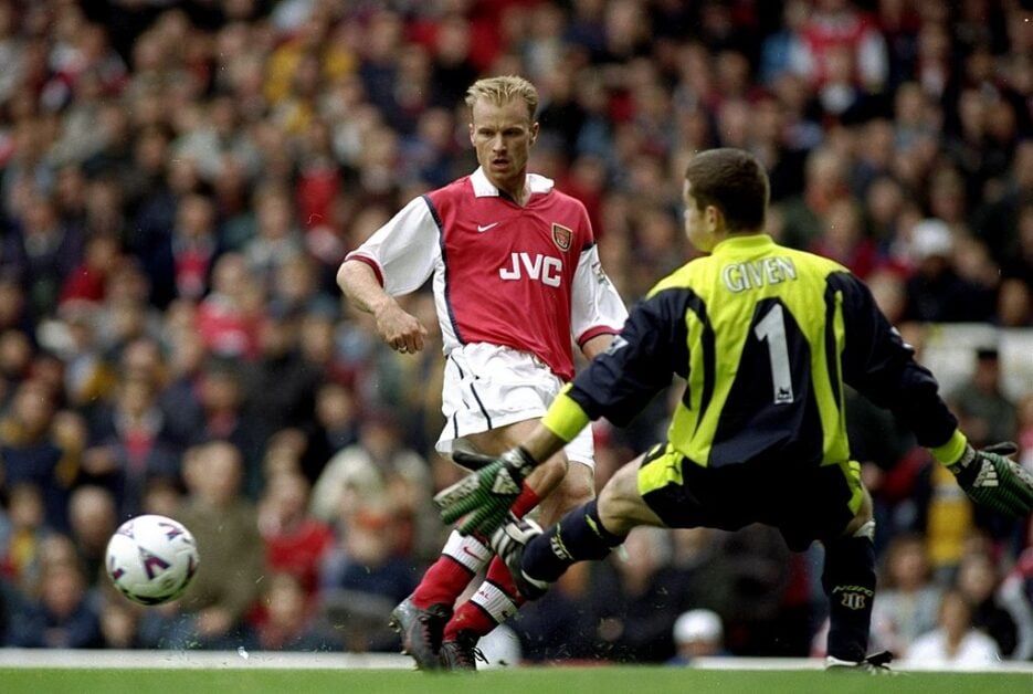 Dennis Bergkamp slotting the ball past Shay Given