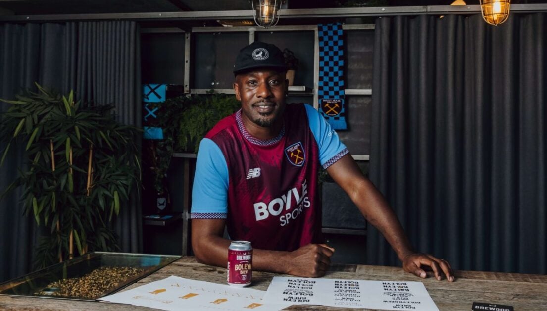 Carlton Cole posing in a West Ham United shirt
